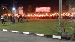 Kapolres Kampar Pimpin Upacara Taptu dan Wabup Lepas Pawai Obor di Mapolres