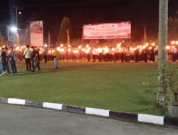 Kapolres Kampar Pimpin Upacara Taptu dan Wabup Lepas Pawai Obor di Mapolres